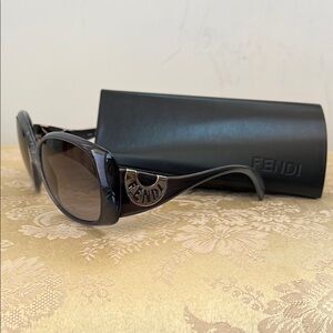 FENDI logo sunglasses with logo case.